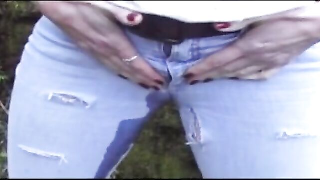 Beautiful MILF peeing in jeans