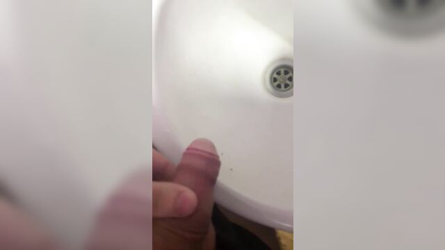 Penis pee in washbasin